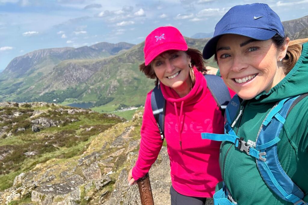 Two women at the top of Cadair Idris Mountain in Snowdonia.