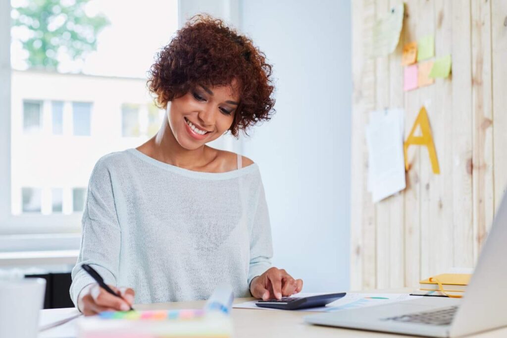 Young woman calculating finances.