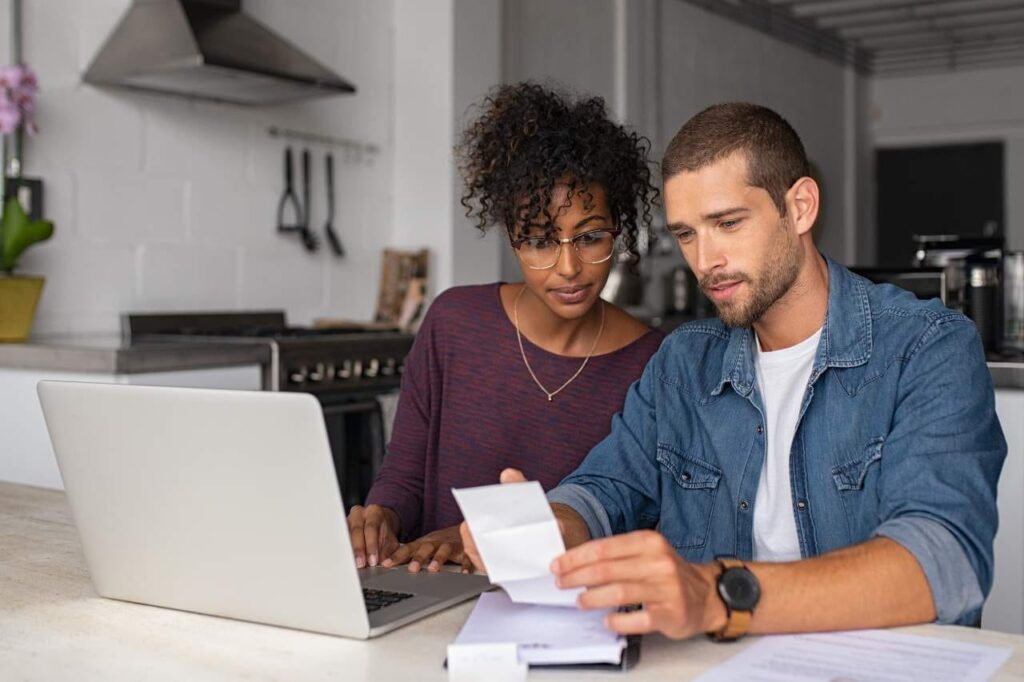 Young couple working on their budget