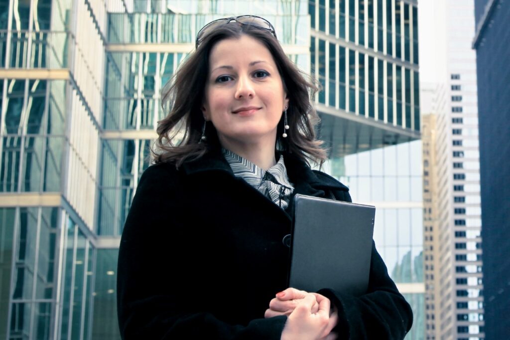 Female solicitor standing outside city offices