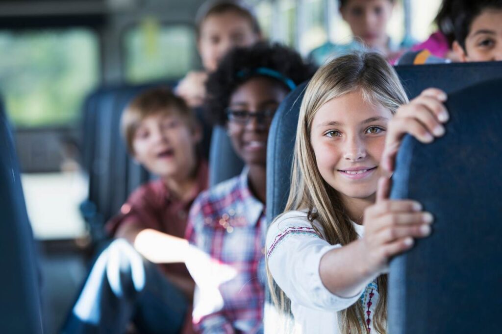 School children on a bus while on an outing.