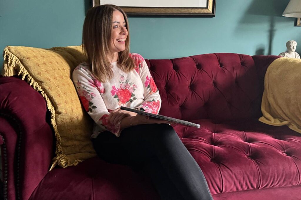 Gemma meeting with a client in their home.